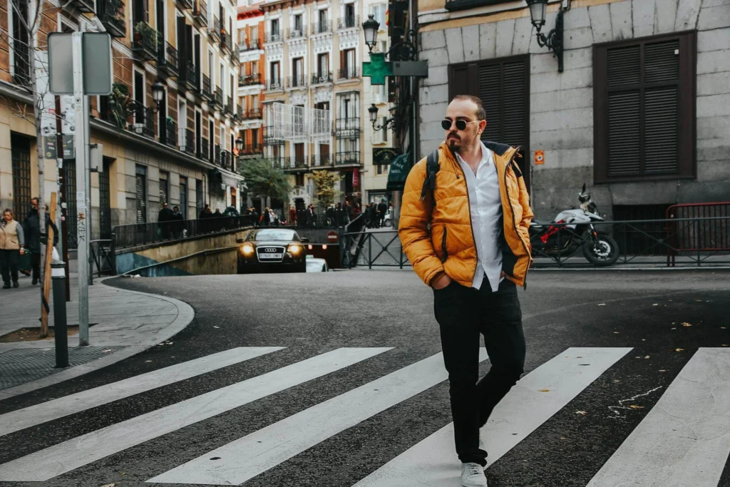 Photo of Man Walking on Pedestrian Crossing
