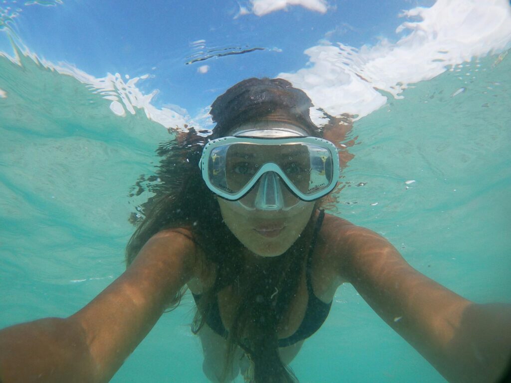 a woman snorkelling in the ocean