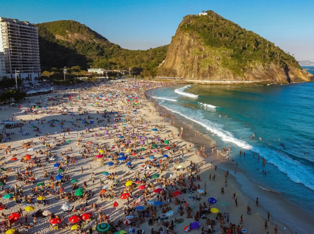 a crowd of people on the beach